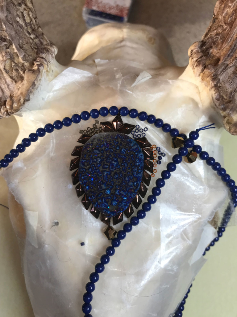 The bead selection process for Blue Moon Shadow, a beaded deer skull artwork piece.