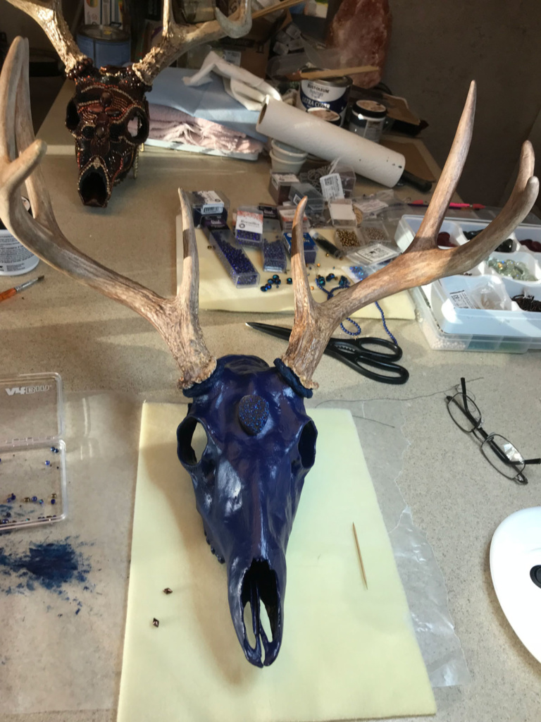 The Whitetail buck skull painted and ready to bead.