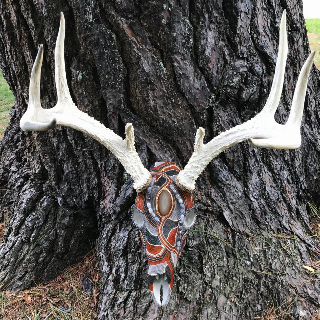 Naming this rustic-chic Whitetail buck skull beaded art piece Mysterious.