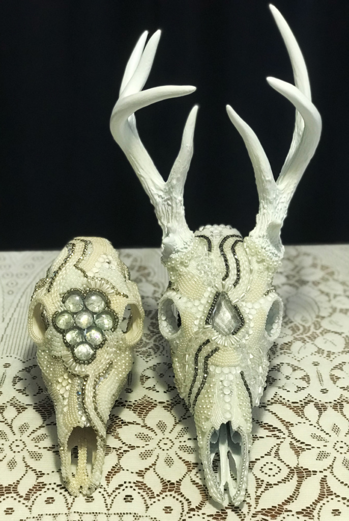 Male and female Whitetail deer beaded skull art; Frozen In Time and White Doe.