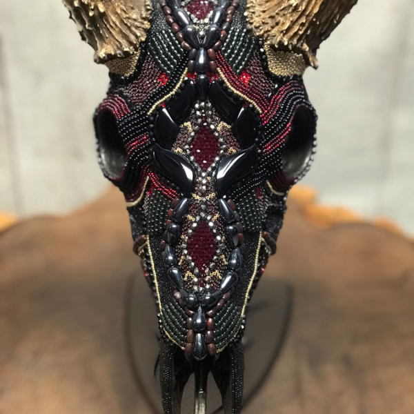 Front view of Thor, a whitetail deer beaded skull art piece.