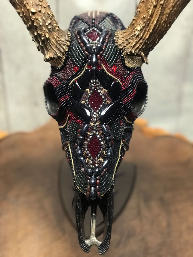 Front view of Thor, a beaded deer skull art piece.